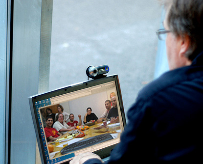 Teacher teaching a group of students via videoconference