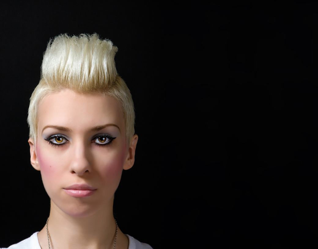 Female model with bleach blonde hair in a fashionable style