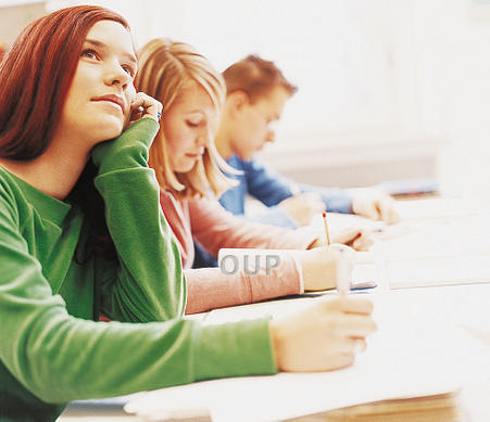 Young woman thinking in exam