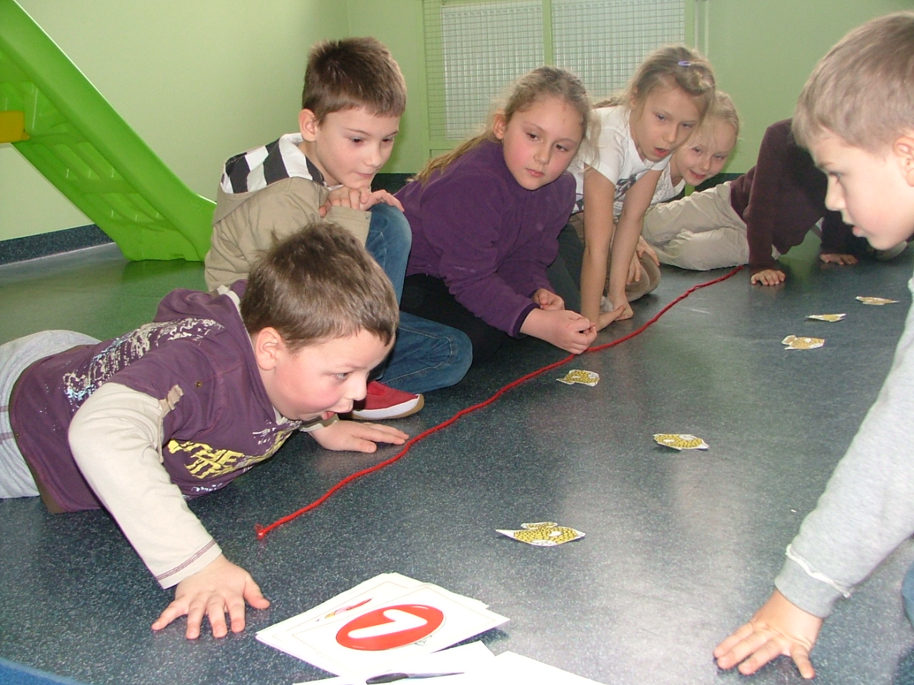 Young children playing the fish game
