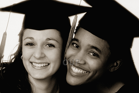 Two female students in graduation robes