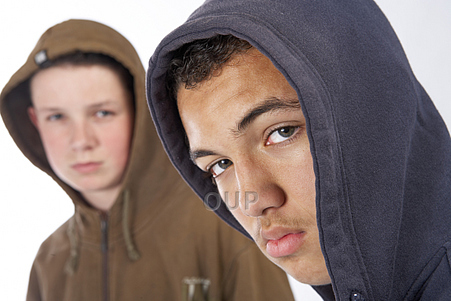 Two teenage boys in hoodies