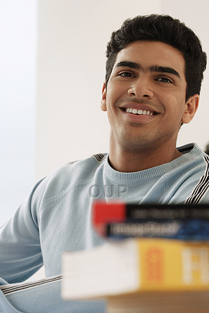 Young adult male learner smiling