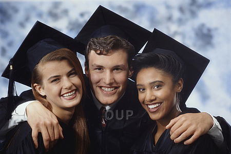 Three graduate students smiling