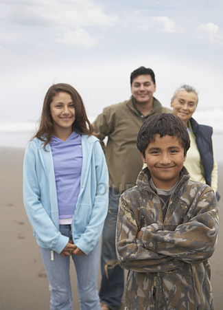 Multi-generation Latin American family on the beach