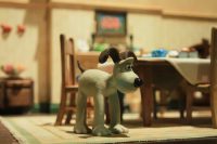 Gromit on all fours in the kitchen