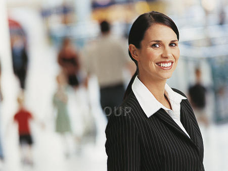 Smartly dressed young woman smiling