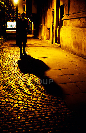 Shady figure walking the streets at night