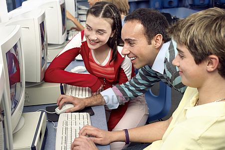 Teacher and students at computer