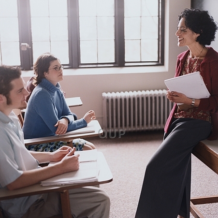 Teacher talking with her students
