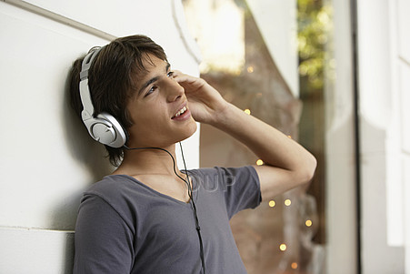 Teen boy wearing headphones