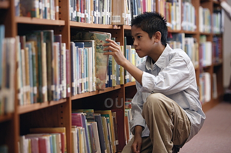 Young boy in library