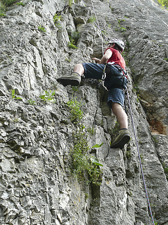 Man climbing a mountain