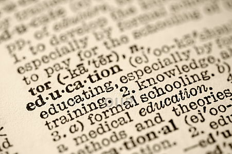 Closeup on dictionary entry for education