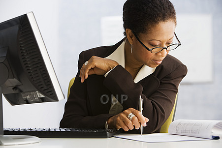 Mature woman working at her desk