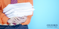man holding a stack of paperwork