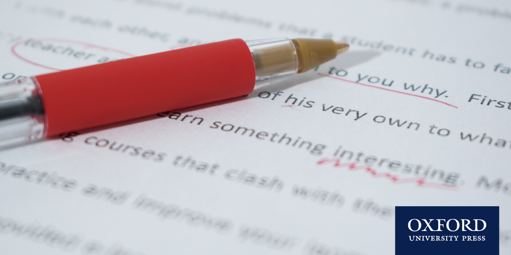 red pen lying on writing, which has been underlined